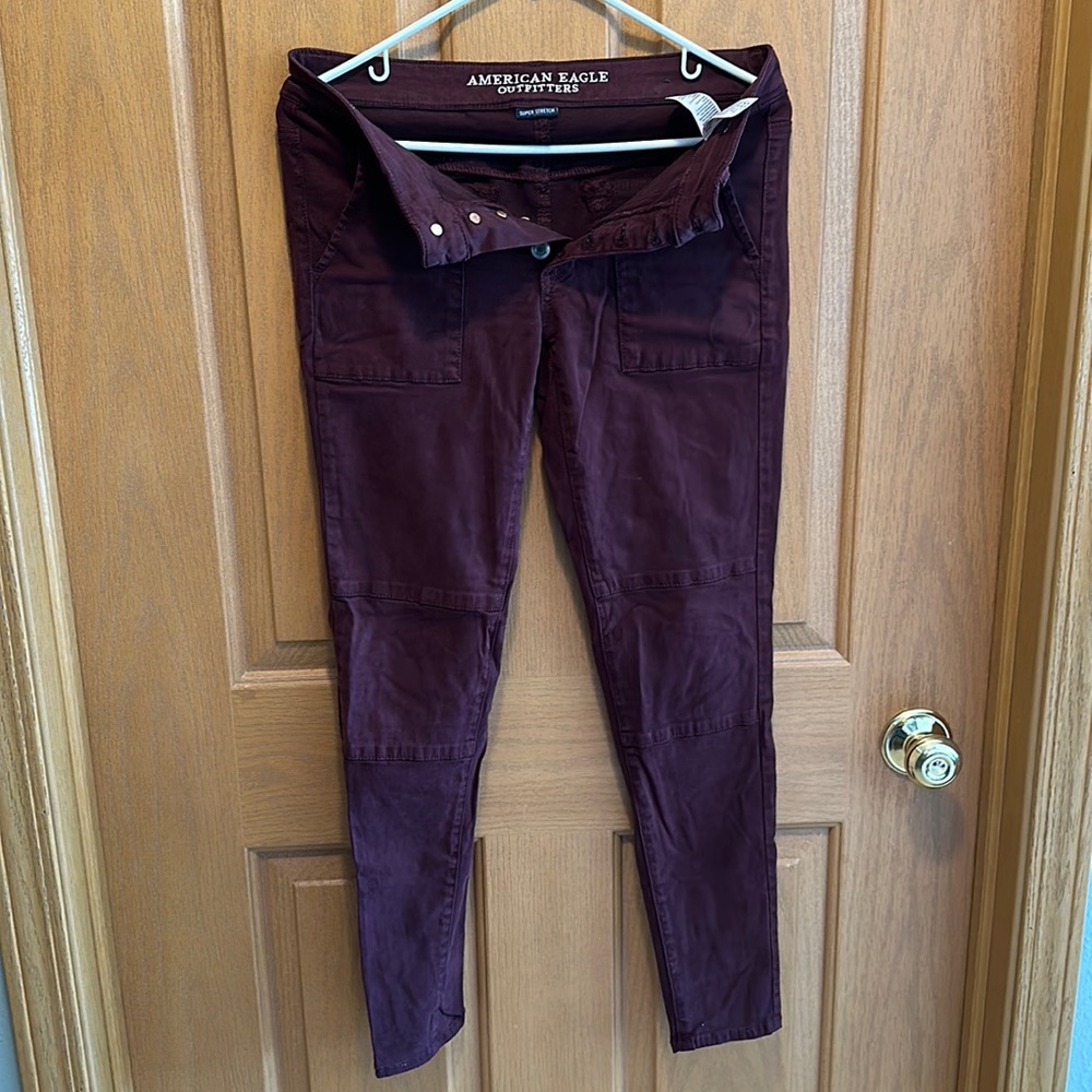 Burgundy jeggings.